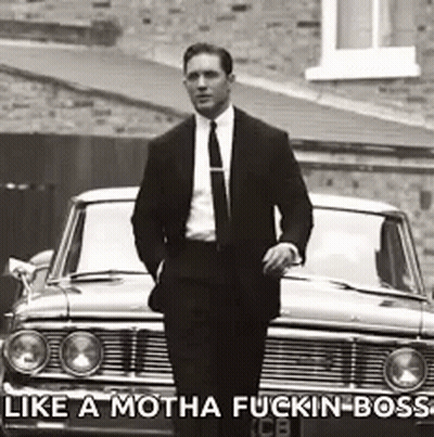 Man In Suit And Tie By Car With Caption Like A Motha Fuckin Boss GIF