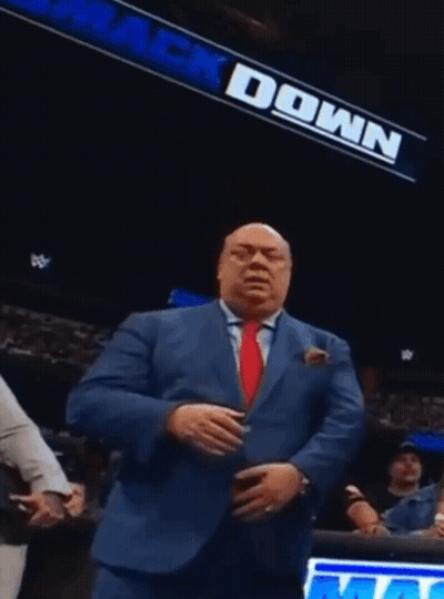 Man In Suit And Tie By Down Sign GIF