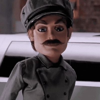Man In Suit And Tie By Ice Sign GIF