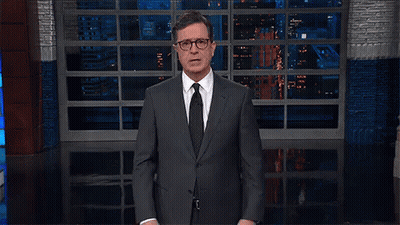 Man In Suit And Tie By Large Window GIF