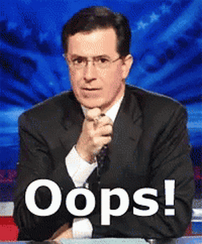 Man In Suit And Tie By Oops Sign GIF