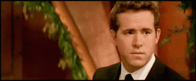 Man In Suit And Tie By Tree GIF