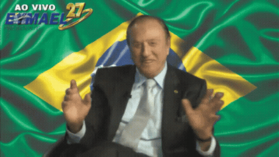 Man In Suit And Tie By Waving Brazilian Flag GIF