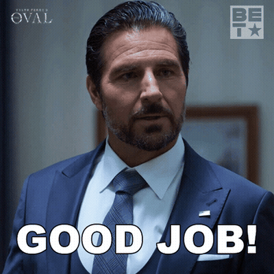 Man In Suit And Tie Clapping City Skyline GIF