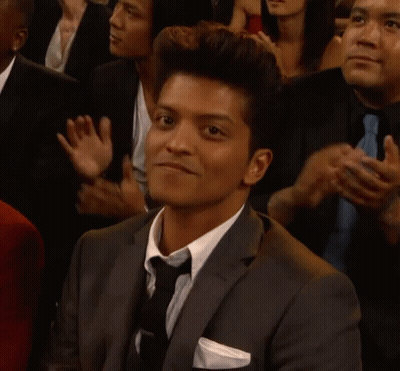 Man In Suit And Tie Clapping In Crowd GIF