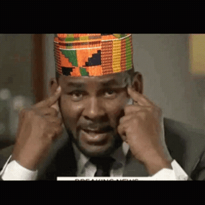 Man In Suit And Tie Covering Ears GIF