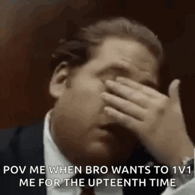Man In Suit And Tie Covering Face GIF