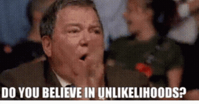 Man In Suit And Tie Covering Mouth GIF