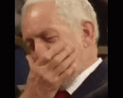 Man In Suit And Tie Covering Mouth GIF