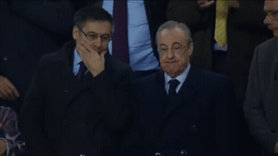 Man In Suit And Tie Covering Mouth GIF