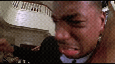 Man In Suit And Tie Crying By Stairs GIF