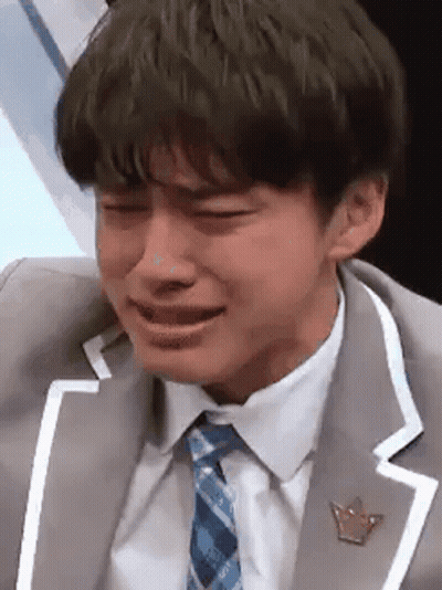 Man in Suit and Tie Crying
