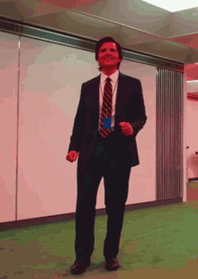 Man In Suit And Tie Dancing In Office GIF