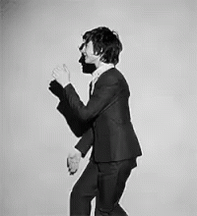 Man In Suit And Tie Dancing GIF