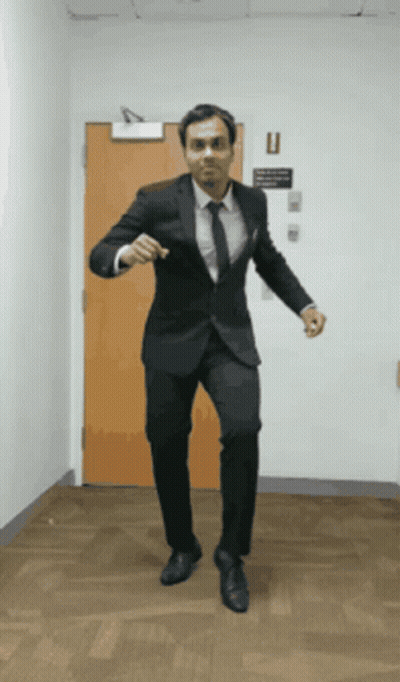 Man In Suit And Tie Dancing GIF