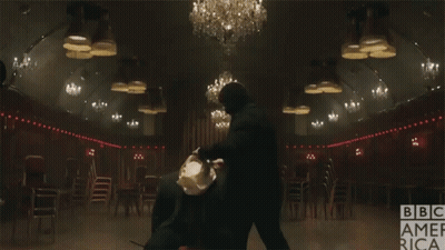 Man In Suit And Tie Dark Room BBC America Logo GIF