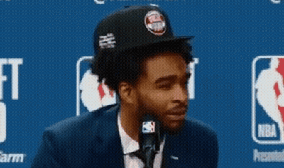Man In Suit And Tie Detroit Pistons Hat On Microphone GIF