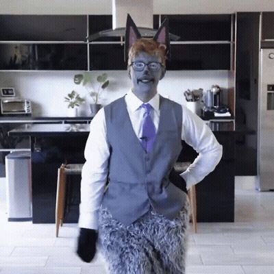 Man In Suit And Tie Dressed As Fox GIF