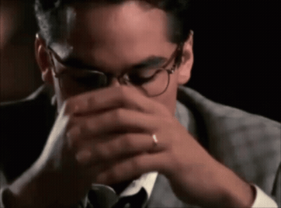 Man In Suit And Tie Drinking From Glass GIF