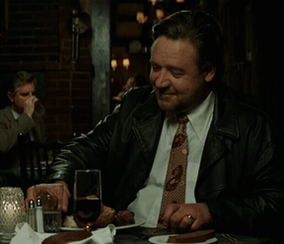 Man In Suit And Tie Drinking From Glass GIF