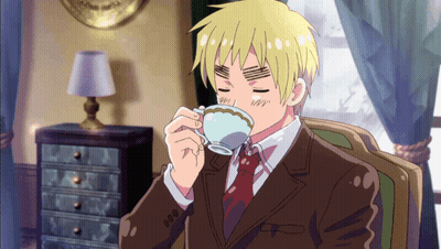 Man In Suit And Tie Drinking From Teacup GIF