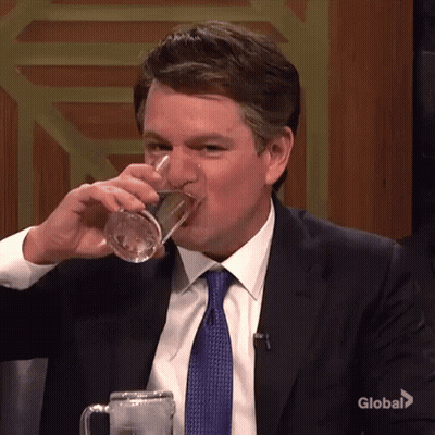 Man In Suit And Tie Drinking Water From Mug GIF