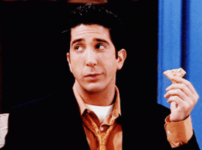 Man In Suit And Tie Eating Pizza GIF
