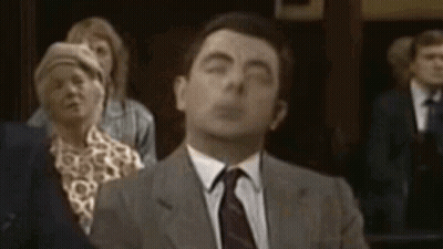 Man In Suit And Tie Eyes Closed Crowd GIF