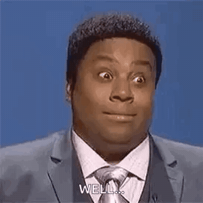 Man In Suit And Tie Funny Face Saying Well GIF