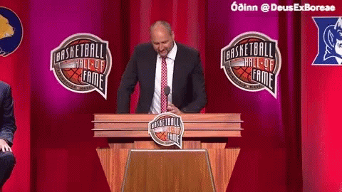 Man In Suit And Tie Giving Speech At Basketball Hall Of Fame GIF