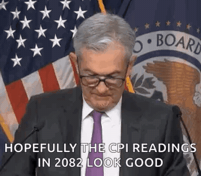 Man In Suit And Tie Giving Speech With American Flag GIF
