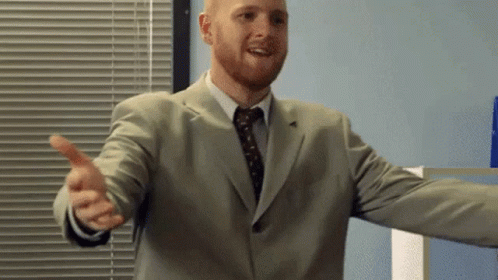 Man In Suit And Tie Giving Thumbs Up GIF