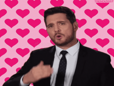 Man In Suit And Tie Giving Thumbs Up With Hearts GIF