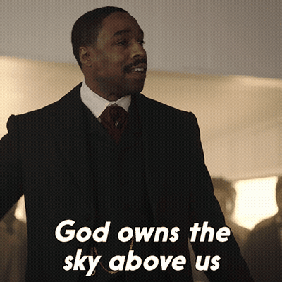 Man in Suit and Tie God Owns Sky