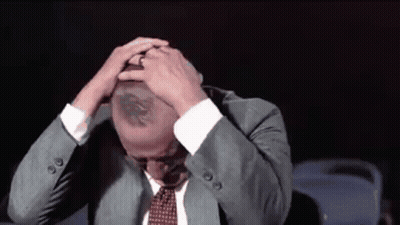 Man In Suit And Tie Hands On Head GIF