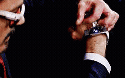 Man In Suit And Tie Holding Bloody Iron Man Glove GIF