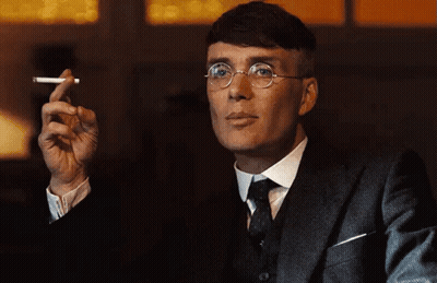 Man In Suit And Tie Holding Cigarette GIF
