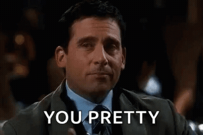 Man In Suit And Tie Holding Drink GIF
