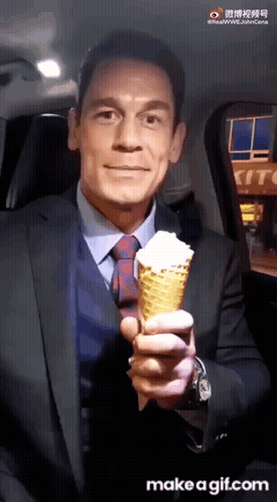 Man In Suit And Tie Holding Ice Cream Cone GIF
