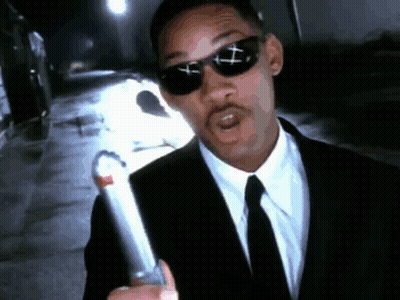 Man In Suit And Tie Holding Lighter GIF