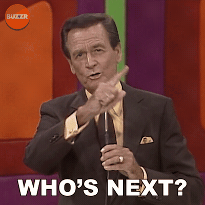 Man In Suit And Tie Holding Microphone Who's Next GIF