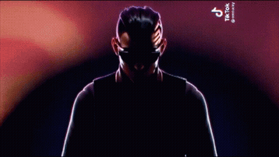 Man In Suit And Tie Holding Microphone With TikTok GIF