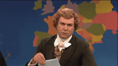 Man In Suit And Tie Holding Paper GIF
