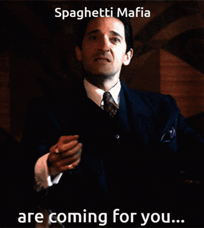 Man In Suit And Tie Holding Paper Saying Spaghetti Mafia Are Coming For You GIF
