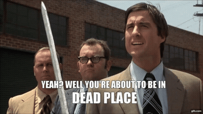 Man In Suit And Tie Holding Sword GIF