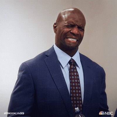 Man In Suit And Tie Holding Water Bottle GIF