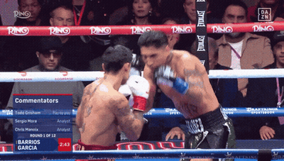Man In Suit And Tie In Boxing Ring With Red Ring GIF
