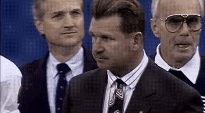 Man In Suit And Tie In Crowd GIF