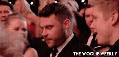 Man In Suit And Tie In Crowd GIF