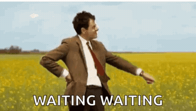 Man In Suit And Tie In Flower Field GIF